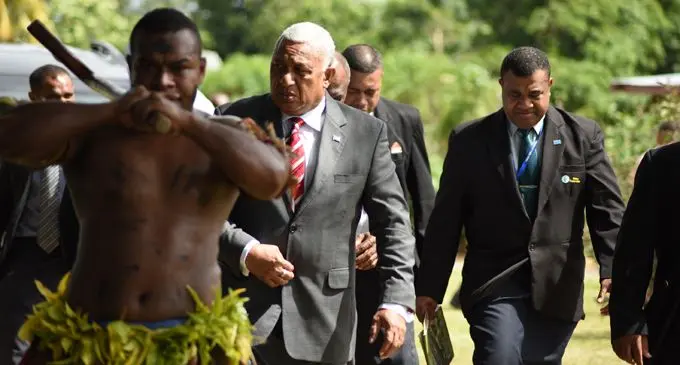Prime Minister Voreqe Bainimarama followed by PS Itakei Affairs Naipote Katonitabua at at Nauluvatu village in Nakelo, Tailevu during Tailevu Provincial Council meeting opening  on April 26, 2018. Photo: Ronald Kumar.
