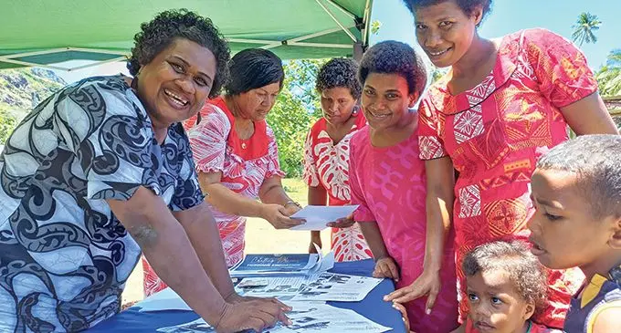Fiji National University staff Sebiuta Utoni (left) with Alisi Dimuri attend to women at their booth during the Macuata District Day in Naduri Village, Labasa on November 23, 2023. Photo: Shratika Naidu