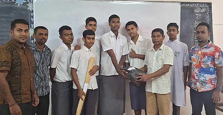 Labasa Muslim College Principal Shanil Dutt (front) handed-over awards to students with Atul Sharma (left) in Labasa on November 22, 2023