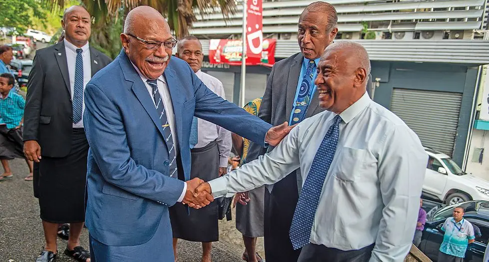 Prime Minister Sitiveni Rabuka with Timoci Silatolu after the first year celebration of the coalition Government church service outside the Centenary Methodist Church on December 24, 2023. Photo: Leon Lord