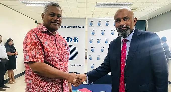 Reserve Bank of Fiji Deputy Governor Esala Masitabua with Fiji Development Bank chief executive officer Saud Minam after the partnership digital signing with Visa Worldwide Pte Limited on September 28,2022. Photo: Laisa Lui.