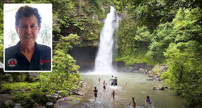 One of the many scenic waterfalls on the island of Taveuni with the inserted image of Graeme Hedge, one of the founders of the Helipro (Fiji) Limited.