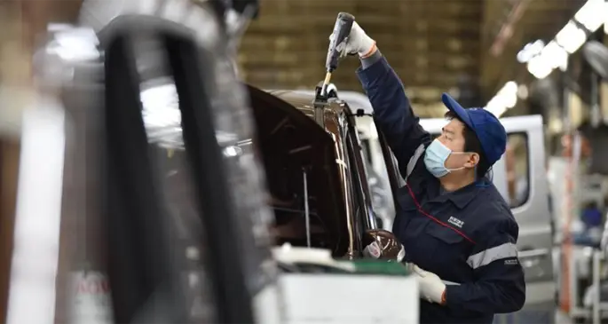 A worker operates at the factory of Chang'an Automobile in Dingzhou, north China's Hebei Province, Feb. 16, 2020. Companies in Dingzhou resumed production with epidemic prevention measures during the outbreak of the novel coronavirus. (Xinhua/Zhu Xudong)