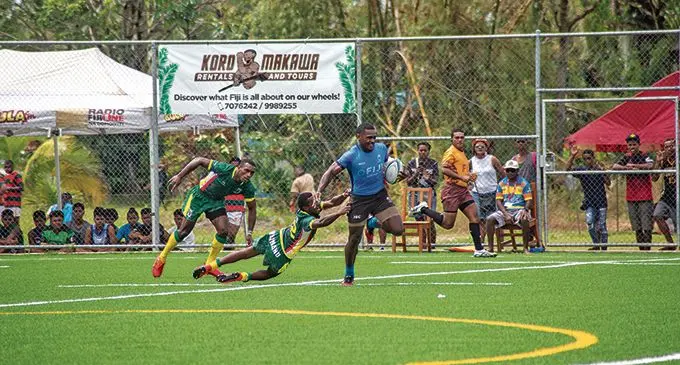 Fiji’s Kaminieli Rasaku evades a tackle by Waidrauso during the Mobile Uprising Sevens tournament at the Uprising Sports center in Pacific Habour , Deuba, on Febuary 6, 2021. Rasaku is former star winger, Sireli Bobo’s choice for rover. Photo: Leon Lord
