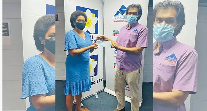R.C.Manubhai regional manager central Shanil Patel presents a cheque to Fiji Cancer Society communications officer Grace Tuvakasiga.