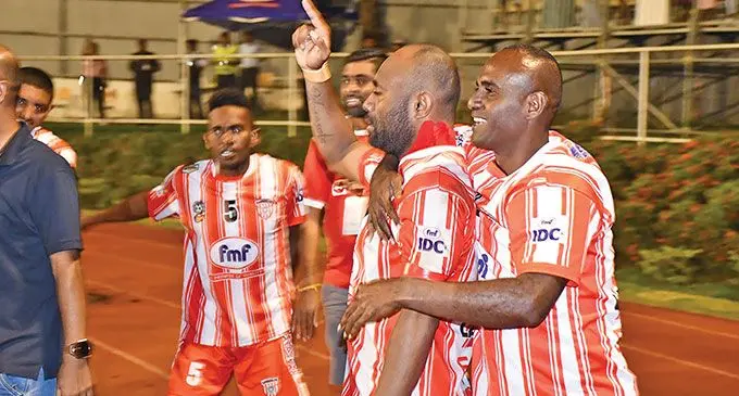 Extra Supermarket Labasa football striker Christopher Wasasala is mobbed by his team-mates after scoring the penalty that gave them the 5-3 win over Navua in the IDC grand-final at Lautoka’s Churchill Park on October 20, 2024. Photo: Waisea Nasokia