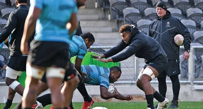Flying Fijians winger Manasa Mataele (with ball) taken to the ground by Kitione Kamikamica while head coach Vern Cotter looks on. The Flying Fijians face the All Blacks in the second Test at FMG Stadium Waikato in Hamilton on Saturday at 7.05pm.  Photo: FRU Media