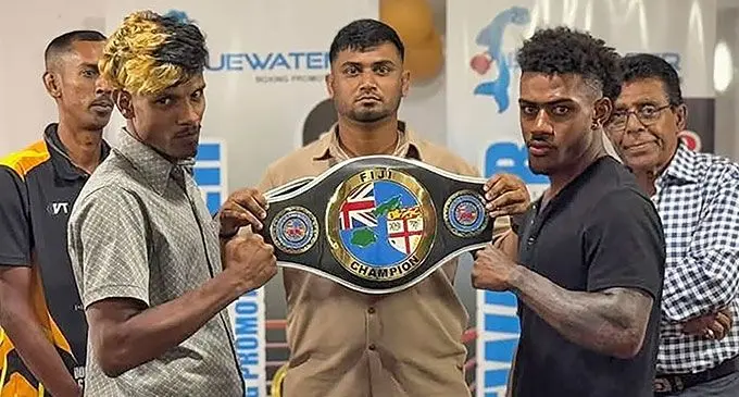 Bluewater Boxing promoter Samir Khan holds the vacant Fiji lightweight title with boxers Mohammed Ali (left) and Mikale Ravalawa (right) in Suva during their promotional outreach. Photo: Bluewater Promotions