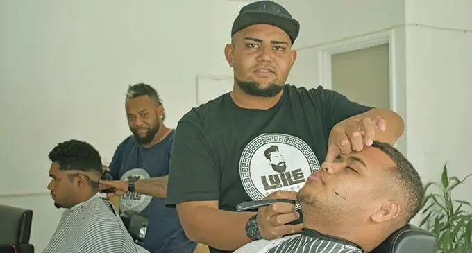 Luke Tokalautawa attending one of his customers. Photo: Mereleki Nai