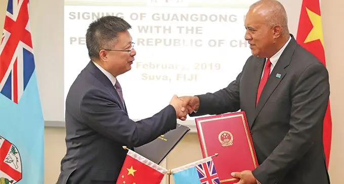 Ambassador of the People’s Republic of China to Fiji Qian Bo and the Permanent Secretary for Foreign Affairs Ioane Naivalurua after the signing at the Ministry of Foreign Affairs headquarters in Suva on March 22, 2019. Photo: DEPTFO News