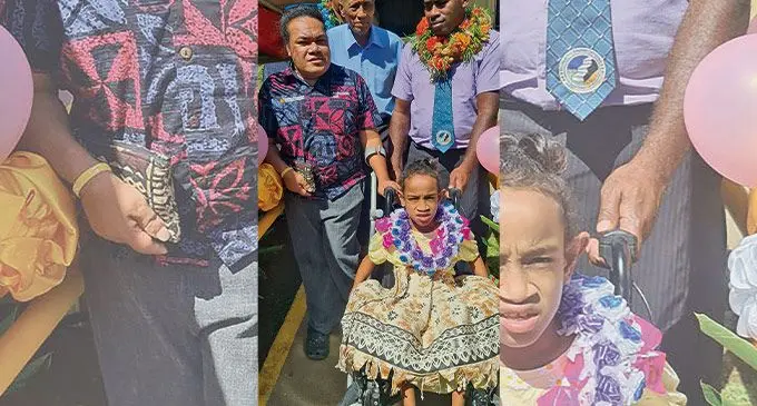 Grace Joy, 8, the first person with disability (in wheelchair) to use the facility is surrounded by Australian Humanitarian Partnership partners, Government officials and Church Agency Network Disaster Operations members during the commissioning of the new retrofitted Seventh Day Adventist (SDA) Church in Savusavu on May 24, 2022. Photo: ADRA