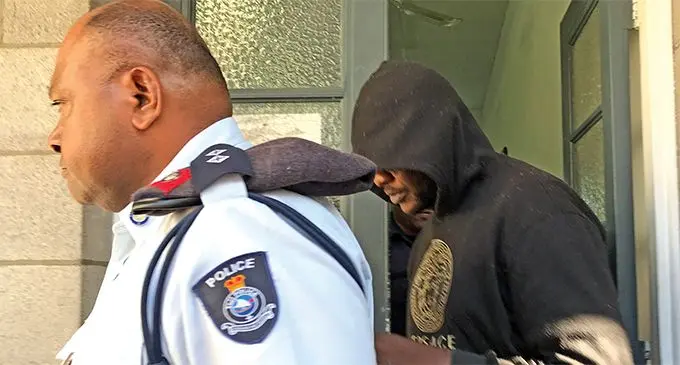 Murder accused Kiala Marcellino Penakoy Henri Lusaka (right) leaves the Magistrates Court in Suva on August 12, 2019. Photo: Ashna Kumar