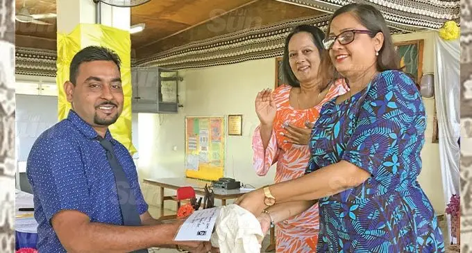 NEW 50 CENTS COINS REACHES THE NORTH ... Minister for Education Rosy Akbar while giving out the new 50 cents coins in the Northern Division advises heads of schools to make sure that they reach their students. Pictured is Duavata Secondary School principal Ajesh Prasad receiving the new souvenir coin from the Reserve Bank of Fiji chief manager of currency and corporate services Susan Kumar (right) and the Minister for Education Rosy Akbar at Labasa College on October 19, 2020. Photo: Shratika Naidu
