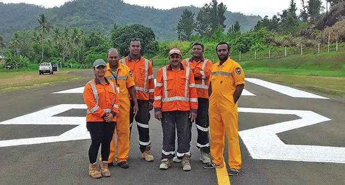 Fiji Airports staff on the newly upgraded Bureta Airport runway  Photo: Fiji Airports 