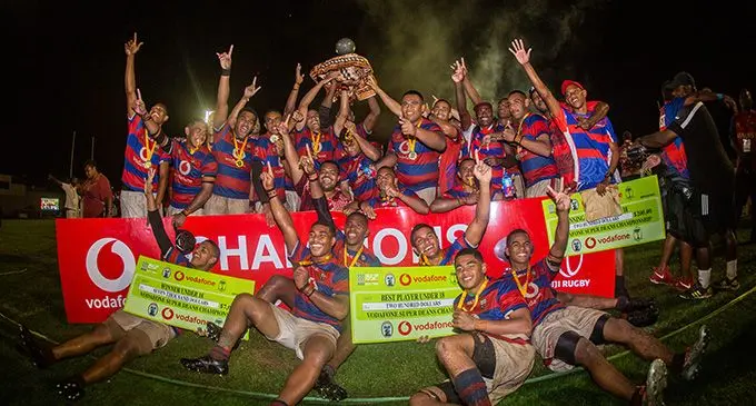 Marist Brothers High School Under-18 rugby players celebrate winning the Vodafone Super Deans Trophy. Photo: Leon Lord