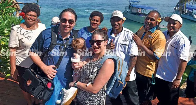 Guests from Melbourne, Andrew, with his wife Simone and daughter Charlotte Alexander with staff of the Sheraton Resort and Spa, Tokoriki Island on May 24, 2022. Photo: Waisea Nasokia