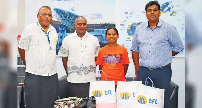 From left: Fiji Telecom general manager corporate services and human resources Samuela Vadei, Fulori Diraboki’s uncle, Jone Temo, Fulori Diraboki, and Charles Goundar, chief executive officer of Telecom Fiji.