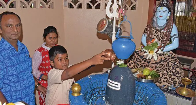 Devotees Depesh Kumar, Ayush Kumar and Nutan Ben  offer their prayers to Lord Shiva (Shiv-linga) during Maha Shivratri pooja at Shiv Temple in Samabula on March 5, 2019.Photo: Ronald Kumar.