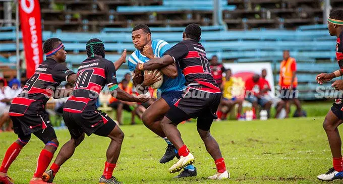 Queen Victoria School Knights Gabriel Lomavatu takes on the  Naitasiri Warriors during the Vodafone Fiji Secondary Schools Rugby  League Under-19 semifinals at Ratu Cakobau Park, Nausori, on June 25, 2022. Photo: Leon Lord.