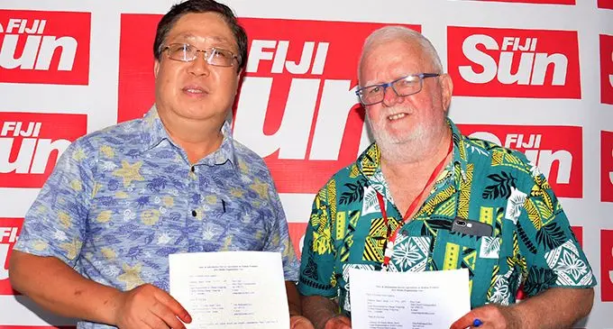  From left: Xinhua Fiji bureau chief  Yongxing Zhang and Fiji Sun Publisher/chief executive officer Peter Lomas after the agreement signing at the Fiji Sun, on February 11, 2020. Photo: Ronald Kumar
