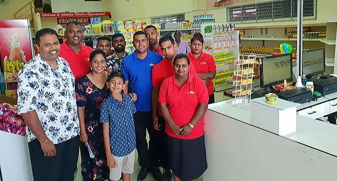 Nukuloa Takolavo Supermarket and Liquor director, Pravinesh Raju (left) with his wife, Pritika (third from left) and their son, Pranav, with the shopping centre staff in Ba following its opening. Photo: Nicolette Chambers