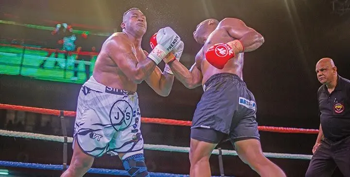 Semi Dauloloma (right), lands a right uppercut on James Singh during their Boxing Commission of Fiji heavyweight title match at the Vodafone Arena, Suva on July 19, 2025. Photo: Josua Buredua