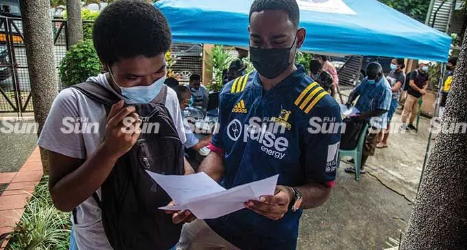 Students Amele Tuvounitoga (left) and Mikaele Finau from Sigatoka applying for the Tertiary Education Loans Scheme (TELS) in Suva on March 24, 2022. Photo: Leon Lord