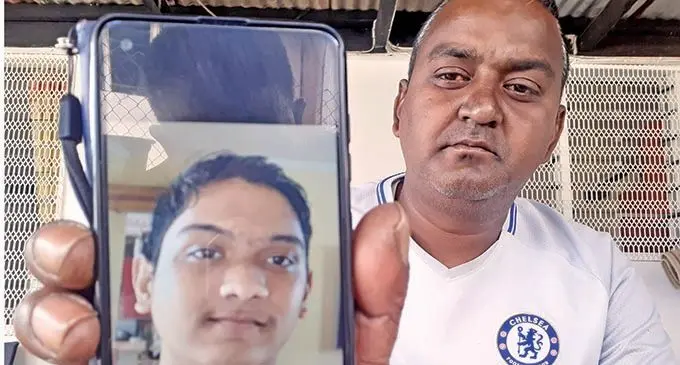 Nitesh Narayan with the picture his late 17 year-old Aryan Narayan, whoes body was found floating at Rewa River on October 21, 2021. Photo: Ronald Kumar.