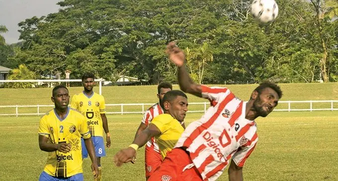Labasa's Siotame Kubu wins header against Nadroga's Paula Buke during the DPL at Lawaqa Park, Sigatoka yesterday. Photo: WAISEA  NASOKIA