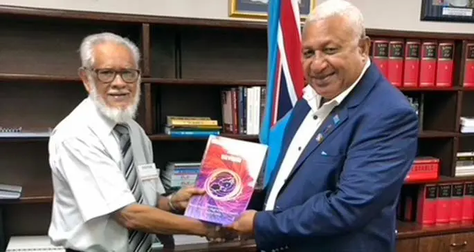 Marist Old Boys, (from left): Caines Jannif Ltd chief executive officer Ikbal Jannif,presents a copy of Memories of Fiji And Beyond to Prime Minister Voreqe Bainimarama.