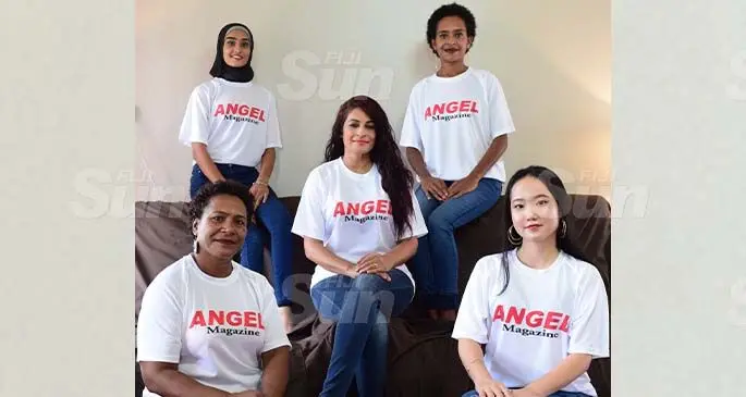 Human rights lawyer Sabrina Khan-Sharma (seated in the middle) with her staff. Photo: Nicolette Chambers