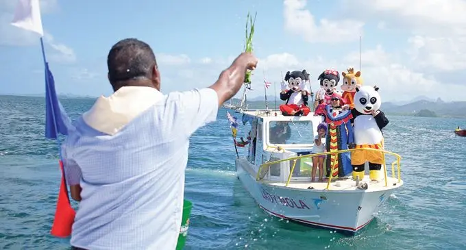 Reverend Father Joseva Tuimavula blesses the boat Lady Nola and its crew during the annual Sail Past event at the Royal Suva Yacht Club, Walu Bay on May 11, 2019. Photo: Ronald Kumar