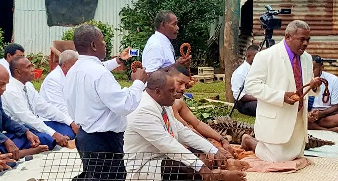 Matacaucau Circuit Minister Reverend Samuel Ulaikarawa presents a tabua to the President of the Methodist Church Rev Epineri Vakadewavosa as the church begins a new journey.