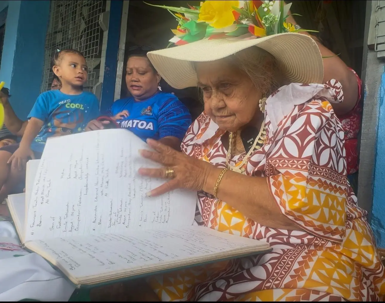 Banaban elder Tute Louis Tetiarahi while going through her family tree book during the 80th anniversary celebrations of the arrival of the Banaban on Rabi Island,