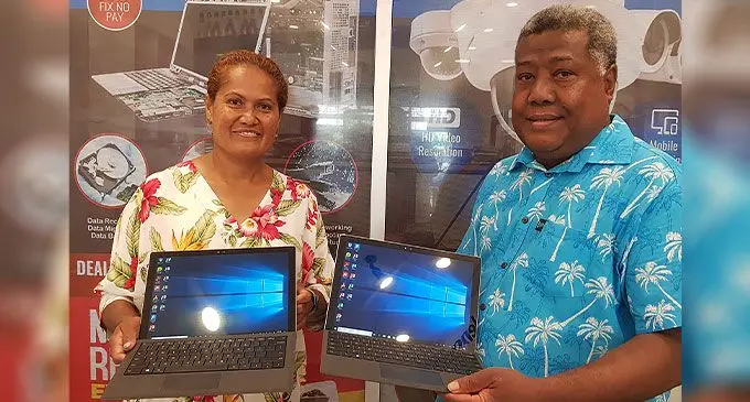 Trinity United Methodist Church representative, Miriam Marama Savali, Delana Methodist High School principal, Isikeli Tuivuna, during the handing over at Fiji Traders in Suva on October 13, 2022. Photo: Viliame Tawanakoro