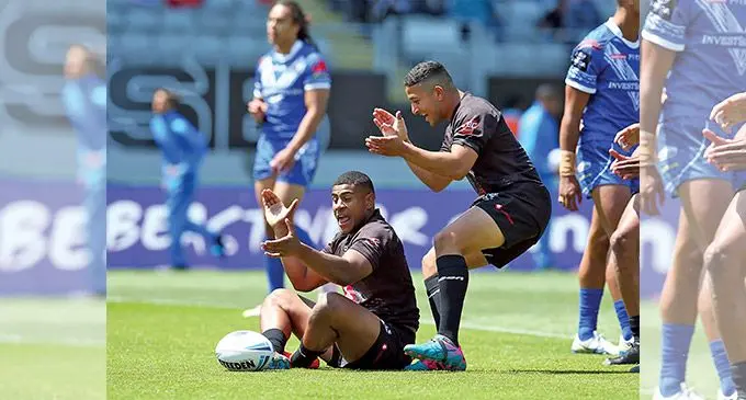 Vodafone Fijian Bati hooker Joe Lovodua (sitting down) and first five Brandon Wakeham celebrate a try in the 2019 Oceania Cup’s 44-18 win over Samoa at Eden Park in Auckland, New Zealand. Photo: NRL.com