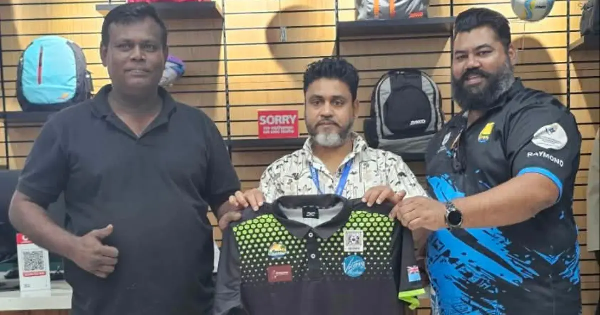 Nitesh Chand (left) and Raymond Reddy (right) receive the Team Fiji kit from DANAM executive Malinda Dias. 