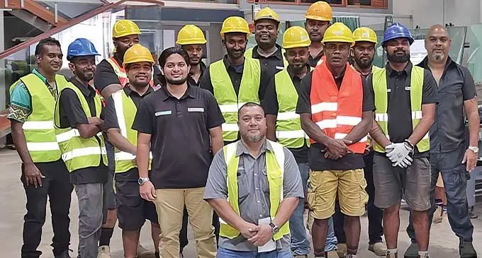 Island Glass & Mirror team with Asish Singh (far right), who encourages growth mindset, and laughter for a healthy happy workplace.