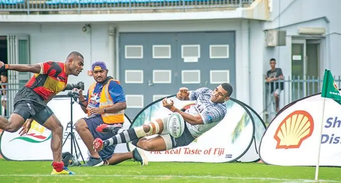 Fijian Shadow captain Meli Derenalagi tries to flick a pass against Fire in the Cup quarterfinal of the Fiji Bitter Marist 7s tournament at the ANZ Stadium, Suva, on March 27, 2021.Photo: Leon Lord