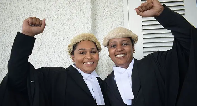 School mates Estein Thaggard and Nicole Prasad celebrate after their admission to the bar on  January 31, 2020. Photo: Ronald Kumar