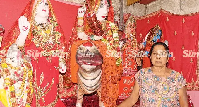 Prem Kumari of Durga Mata Mandir (Temple) in Koronivia, Nausori, on May 17, 2022, with some of the temple items that were  damage following the alleged break-in. Photo: Ronald Kumar