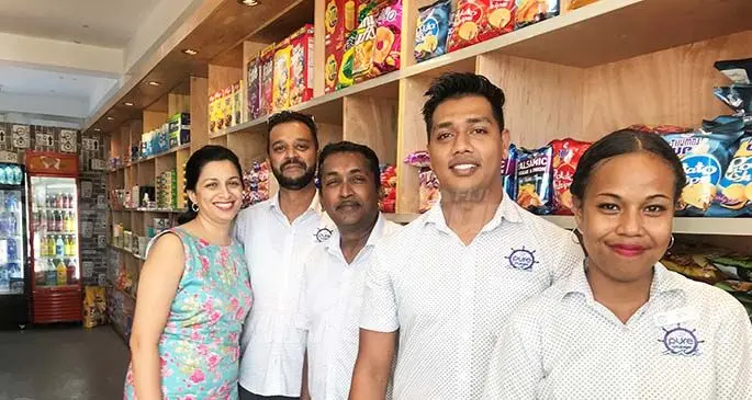 From left: Vandhana Sharma and husband Navneet Dutt, with staff, Shamimul Haq, Ronald Madhwan and Setaita Lekanagata inside the new Superette on Fantasy Island. Photo: Charles Chambers