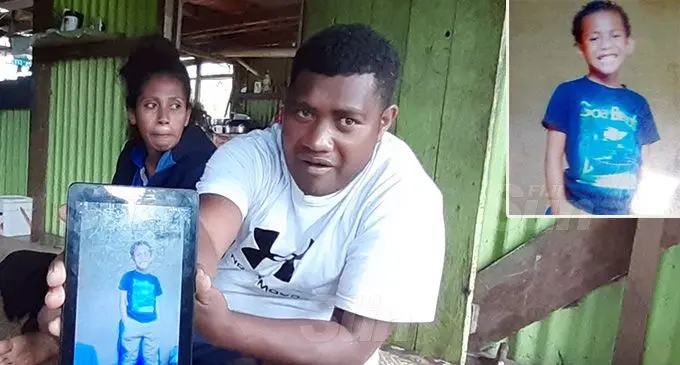 Meli Yasawa with his wife Lusiana Tuiraloga showing a photo of their son, Mitieli Namuka at their home in Natoaika Village Photo: Shalveen Chand. Inset: Mitieli Namuka.