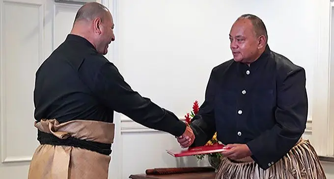 King Tupou VI presents a Royal Warrant of Appointment to Prime Minister Siaosi Sovaleni, at the Royal Palace, Nuku’alofa, on December 28, 2021.