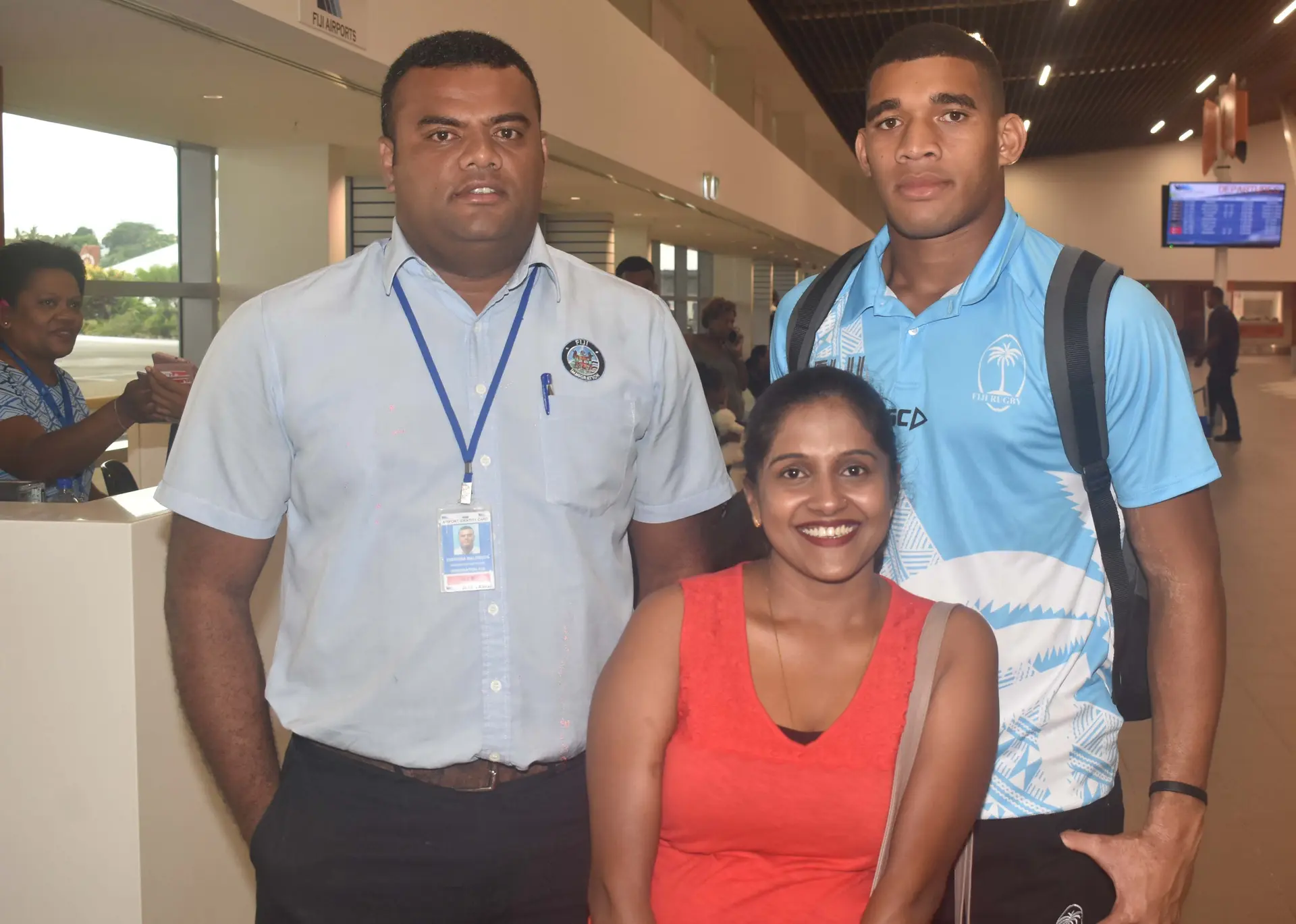 Fiji Airways 7s rep Meli Derenalagi with fans at the Nadi International Airport yesterday. Photo: WAISEA NASOKIA