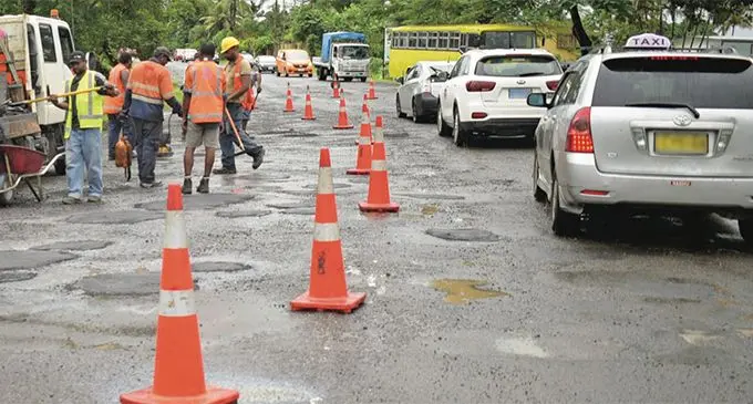 Fiji Roads Authority subcontractors patch potholes along Princes Road in Tamavua on April 24, 2019. Photo: Ronald Kumar