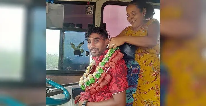 Dalip Chand and Son Private Limited bus driver, Avinesh Krishna is garlanded by Diana Prasad at Vatulovona Village in Labasa on March 24, 2023.