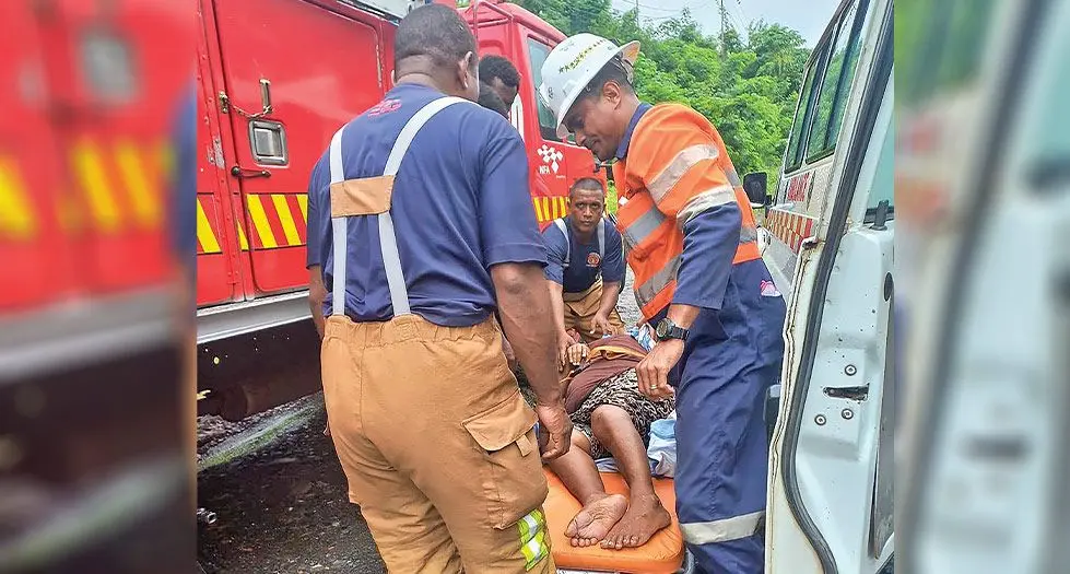 National Fire Authority officers try to comfort the 61-year-old woman at Lakalaka settlement in Tavua on March 21, 2024. Photo: National Fire Authority