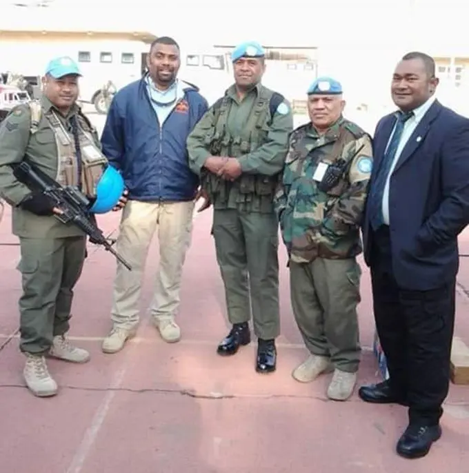 The late Mr Tabuatausole (standing 2nd from the right with blue jacket) with members of the Fiji Contingent serving with the UN Assistance Mission in Iraq, 2006. Photo 1. The late Mr Tabuatausole (standing 2nd from the right with blue jacket) with members of the Fiji Contingent serving with the UN Assistance Mission in Iraq, 2006. 