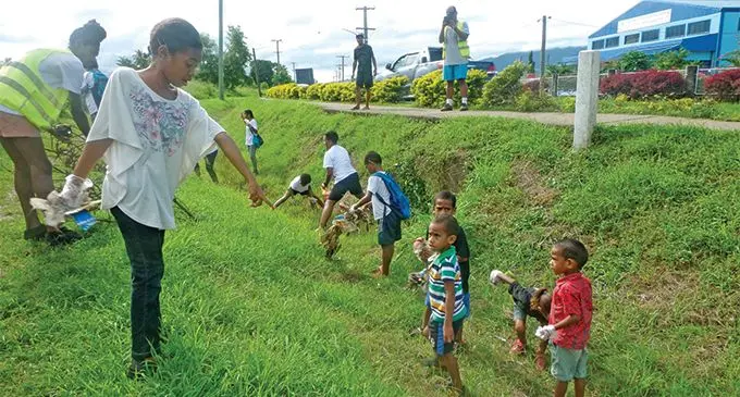 Children with their parents collect rubbish along Lovu Road, Lautoka for the clean-up campaign on April 27, 2019. Photo: Rohit Kumar